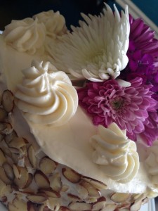 Mother's Day Cake with Flowers, Cream Cheese Frosting, and Almond Garnish