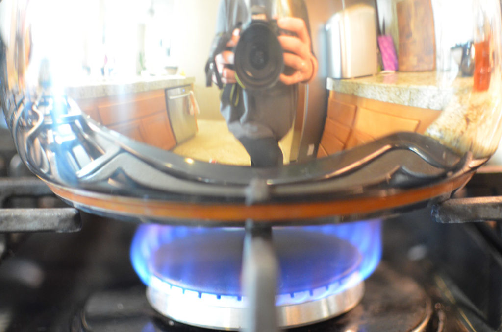 Taking a picture of the pot on the burner