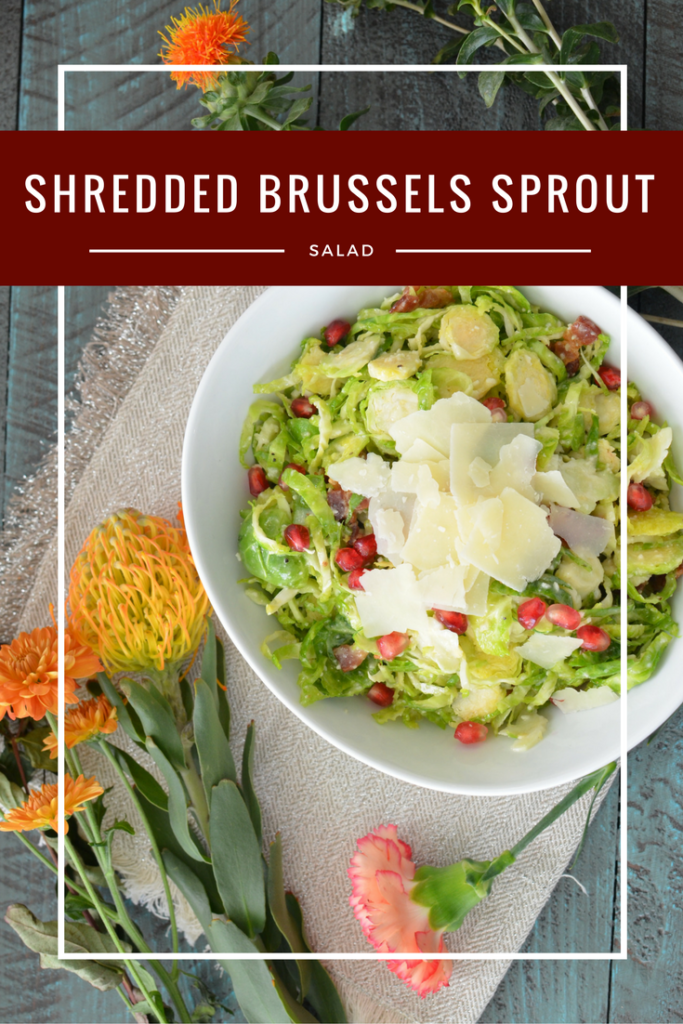 The most addicting salad! Shredded Brussels sprouts with crisp bacon, Parmesan, and pomegranate seeds tossed in a creamy dressing!