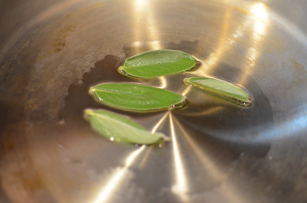 Olive oil and sage leaves