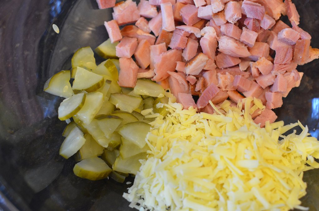 It really is as simple as it looks! Chopped pickles, swiss cheese, and a thick slice of ham cut into bite-sized pieces are your main ingredients! 